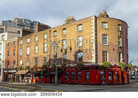Dublin, Ireland - 10 November 2015: Typical, Red Pub Doyle At College Street In The Center Of Capita