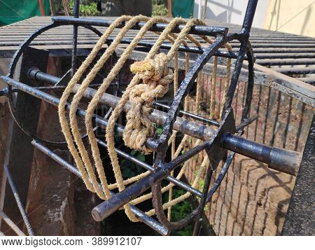 Old Vintage Water Remover Wheel To Pull Water Outside Of Water Well Made Of Iron And Then With Rope 