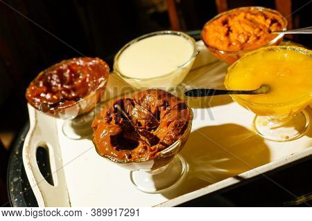 Chocolate Dessert Panna Cotta, Vanilla Puding, Fruit Jelly. Tasty Desserts In Glass Bowls
