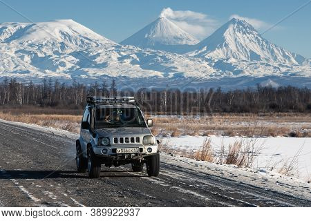 Japanese Suv Suzuki Jimny Driving Along Road On Background Beautiful Winter Landscape Travel Destina