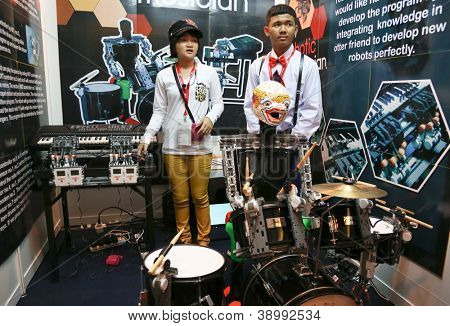 SUBANG JAYA - NOV 10: Unidentified students from Thailand show their music robots at the World Robot Olympaid on November 10, 2012 in Subang Jaya, Malaysia. The theme is connecting people with robots.
