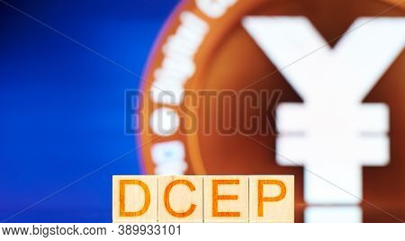 Dcep. Wooden Blocks With Dcep Lettering On Digital Yuan Coin Background