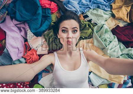 High Angle Above View Photo Of Lovely Lady Home Spring Cleaning Household Lying Many Clothes Stack F