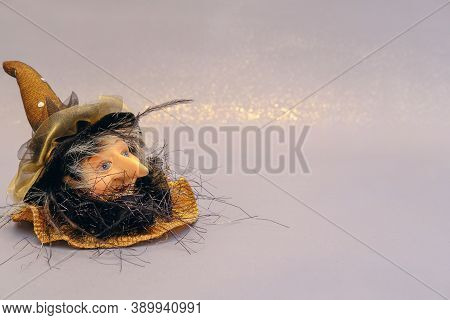Halloween Holiday Background. A Head Of Aged Witch With Kindness Face.halloween Home Decoration. Con