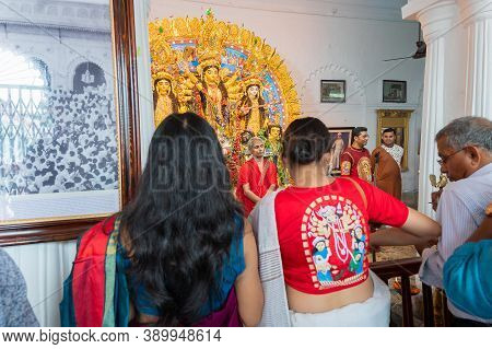 Kolkata, West Bengal, India - 6th October 2019 : Modern Sari Clad Devotee Woman With Goddess Durga P