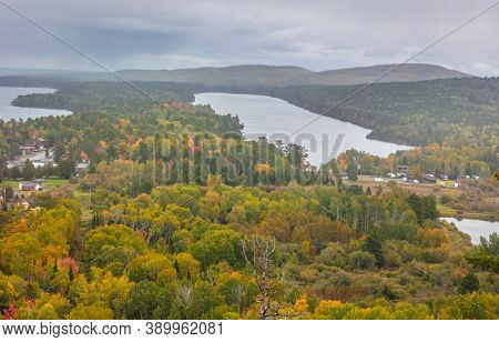 Carpet of trees by the Lake Fanny Hooe near Copper harbor in Michigan upper peninsula on a cloudy autumn day.