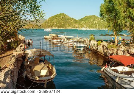 Canal In The Center Of The Coastal City Of Marmaris. Icmeler Area. Sea And Mountain Views Background