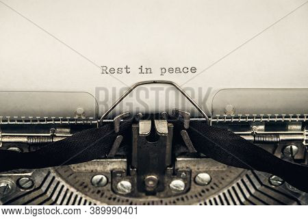Typing A Message Rest In Peace On A Vintage Typewriter Close-up