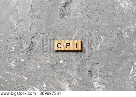 Cpi Word Written On Wood Block. Abbreviation Consumer Price Index Text On Cement Table For Your Desi