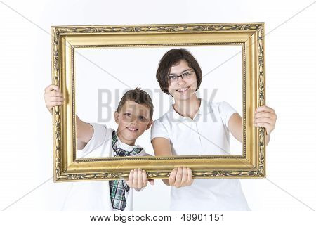 Brother and sister portrait holding picture frame