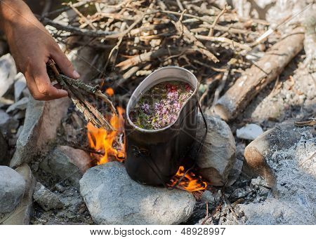 Preparing Tea On Campfire In Wild Camping.
