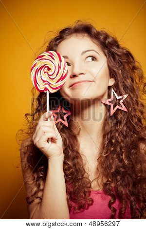 happy young woman with lollipop