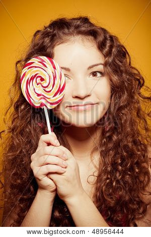 happy young woman with lollipop