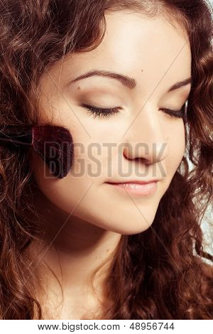 woman is making make-up