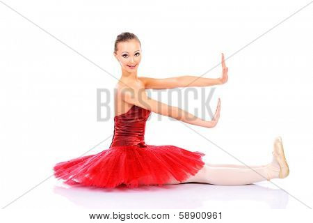 Professional bellet dancer posing at studio. Isolated over white background. 