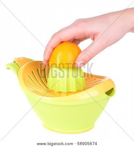 Preparing fresh lemon juice squeezed with hand juicer isolated on white
