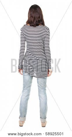 back view of standing young beautiful  brunette woman in striped frock. girl  watching. Rear view people collection.  backside view of person.  Isolated over white background.