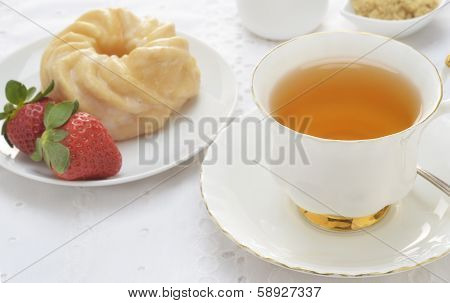 Tea  With Cruller And Strawberries