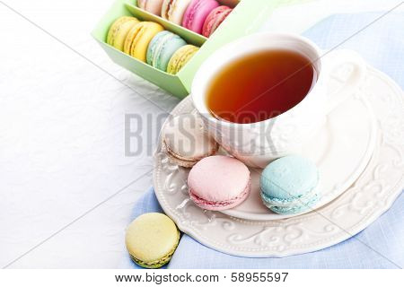 Cup Of Tea With Colorful Macarons