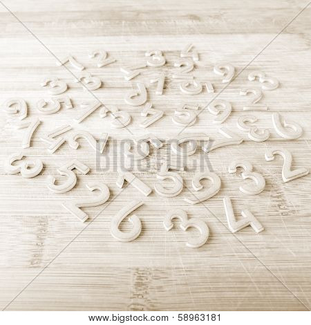 Number scattered on wooden table