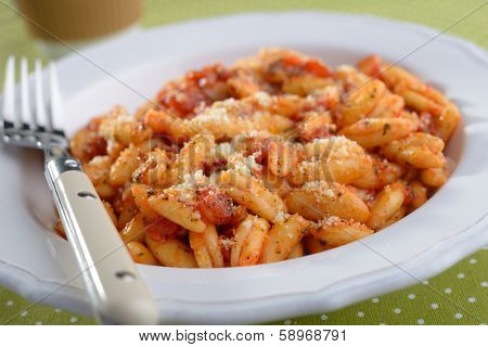 Capunti with Parmesan cheese and tomato sauce