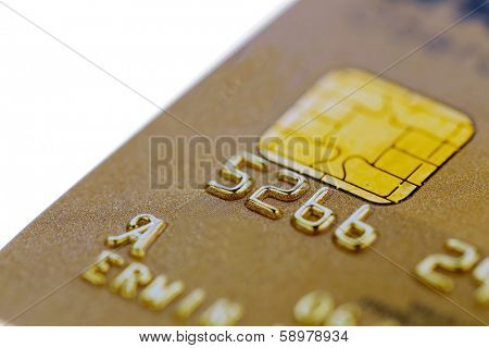 a gold credit card. symbolic photo for cashless purchases and status symbols.