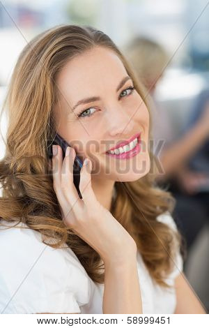 Close-up of a beautiful businesswoman using mobile phone