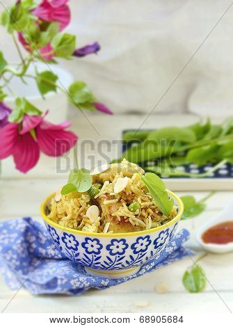 Pilaf With Chicken, Peas And Almonds