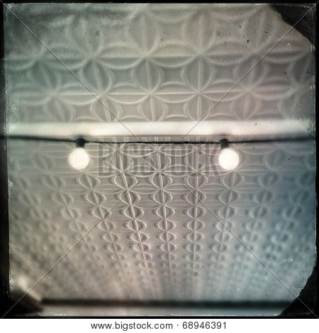 Instagram filtered image of an old pressed tin tiled ceiling