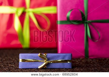Three presents, bows and ribbons
