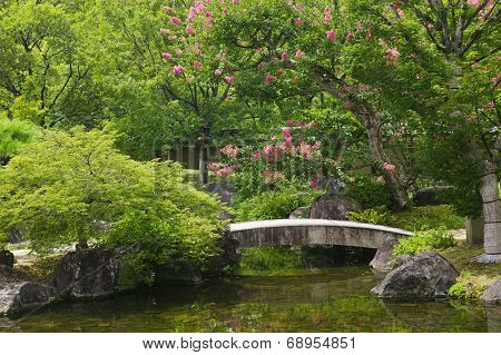 Japan, Himeji, Himeji Koko-en Gardens, stone bridge over stream