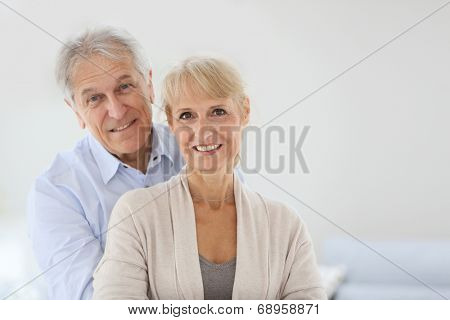 Cheerful senior couple embracing each other