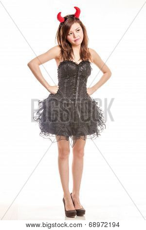 Chinese Woman In Black Dress And Devil Horns Standing With Hands On Waist Pouting