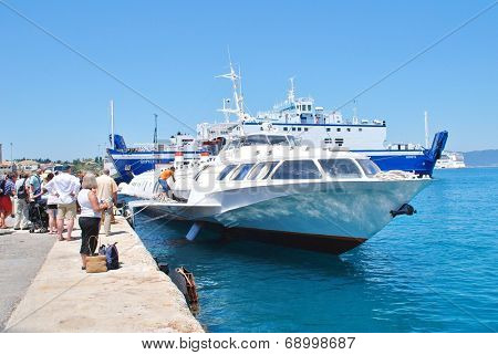 CORFU, GREECE - JUNE 23, 2014: Joy Cruises hydrofoil Ilida II disembarks passengers from Paxos at Kerkira harbour on the Greek island of Corfu. The 35mtr long vessel was built in Georgia in 1982.