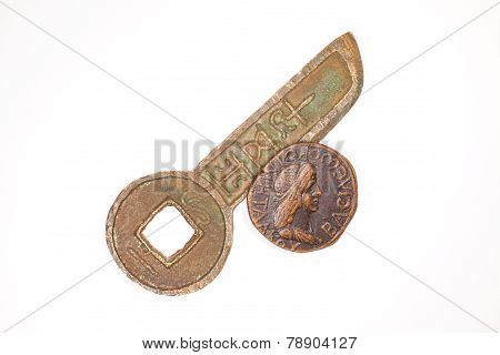 Two ancient bronze coin with a portrait of the emperor on a white background