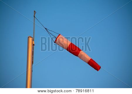 Close Up Of A Wind Sock Under A Blue Sky