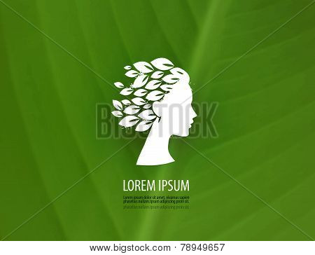Head of a young girl on the green . Logo, icon