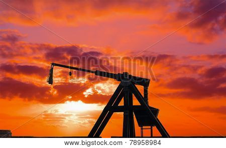 Catapult Silhouette Under A Red Sunset