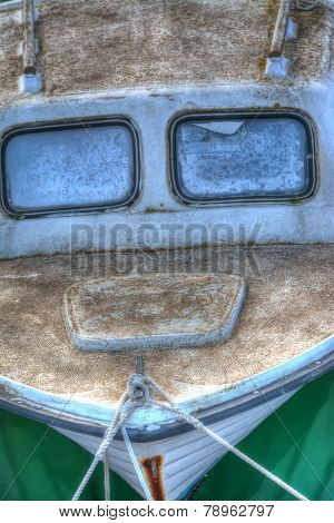 Old Boat Tied To The Dock