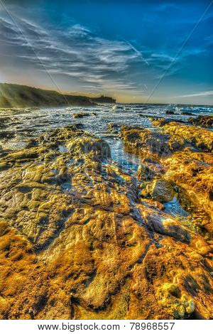 Orange Rocks By The Shore In Porto Ferro Beach