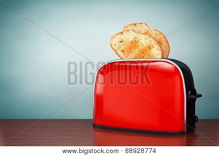 Old Style Photo. Toast Popping Out Of Vintage Red Toaster