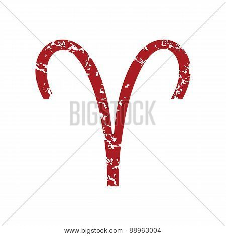 Red grunge Aries logo