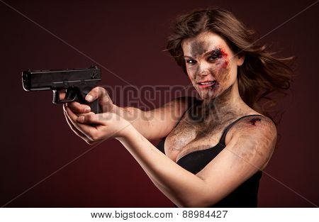 Beautiful, hot and sexy woman with gun. Riot girl.