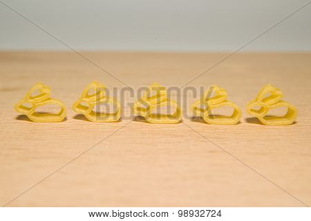 Pasta In The Form Of Rabbits On A Wooden Surface