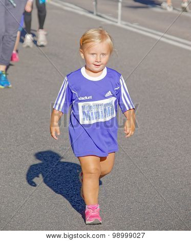 Happy Young Blonde Girl Walking