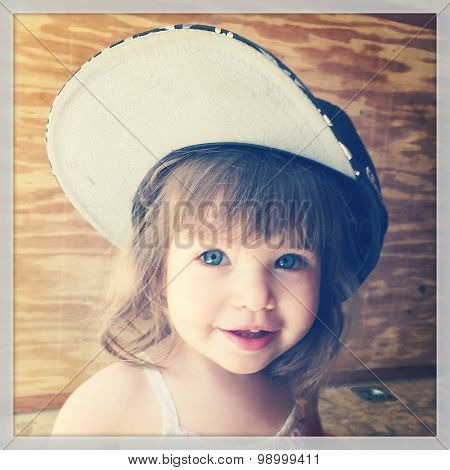 Little girl with hat on her head - With Instagram effect