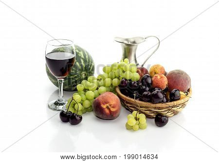Summer fruit and wine on a white background closeup