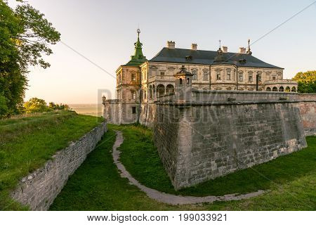 Medieval Pidhirtsi Castle in sunset summer light, Pidhirtsi village, Lviv region, Ukraine≠