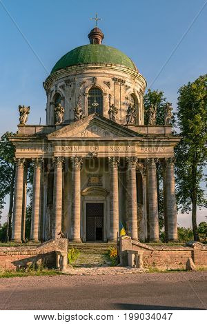 Baroque Roman Catholic church of St. Joseph in Pidhirtsi. Pidhirtsi village is located in Lviv province, Western Ukraine. Summer sunset light.