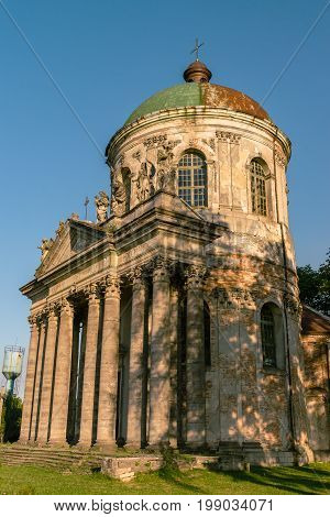 Baroque Roman Catholic church of St. Joseph in Pidhirtsi. Pidhirtsi village is located in Lviv province, Western Ukraine. Summer sunset light.